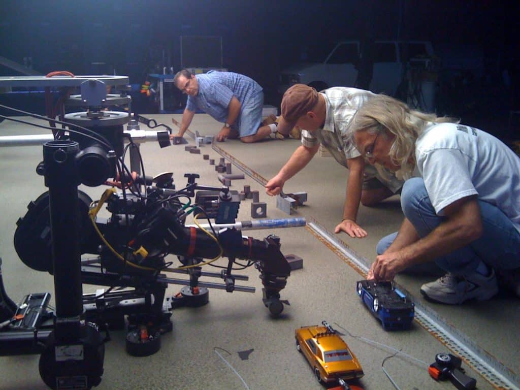 setting up a video production shoot for toy cars