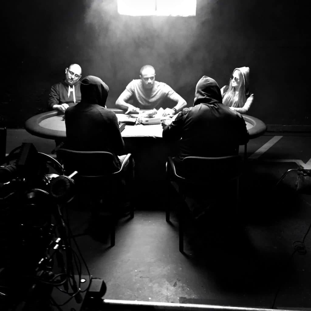 black and white people playing poker