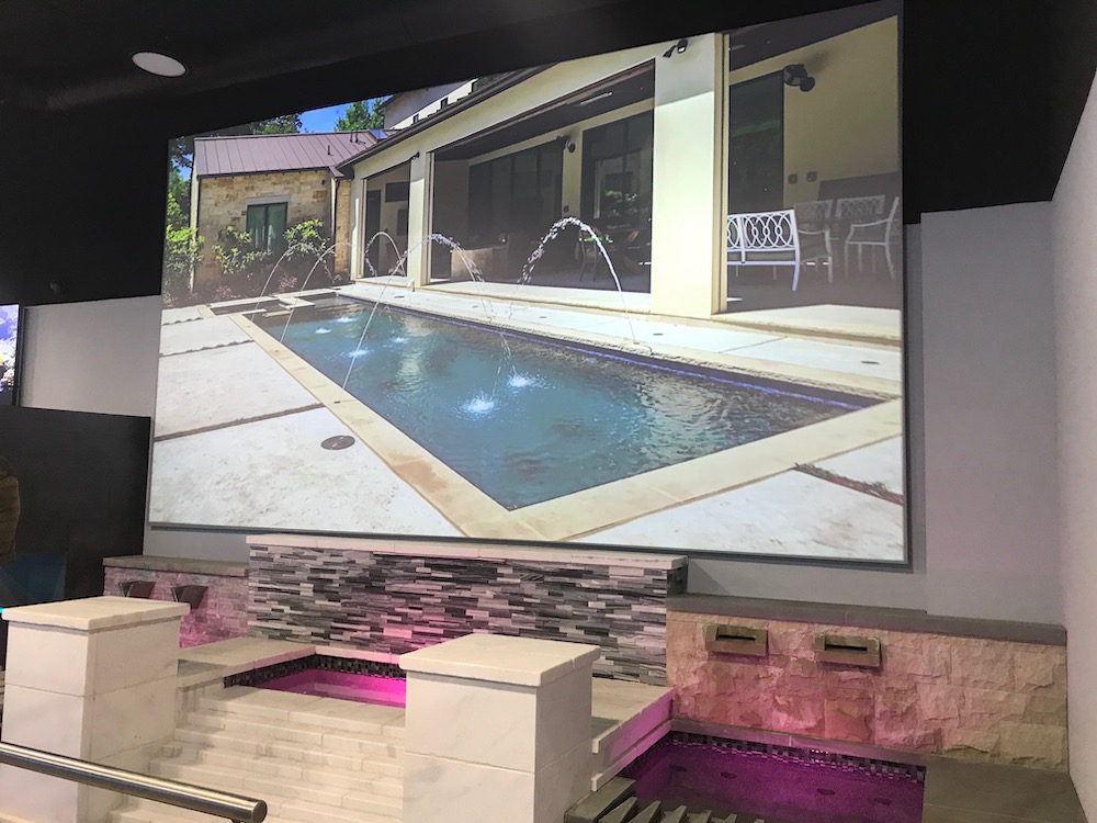 Product demo videos are featured throughout the showroom