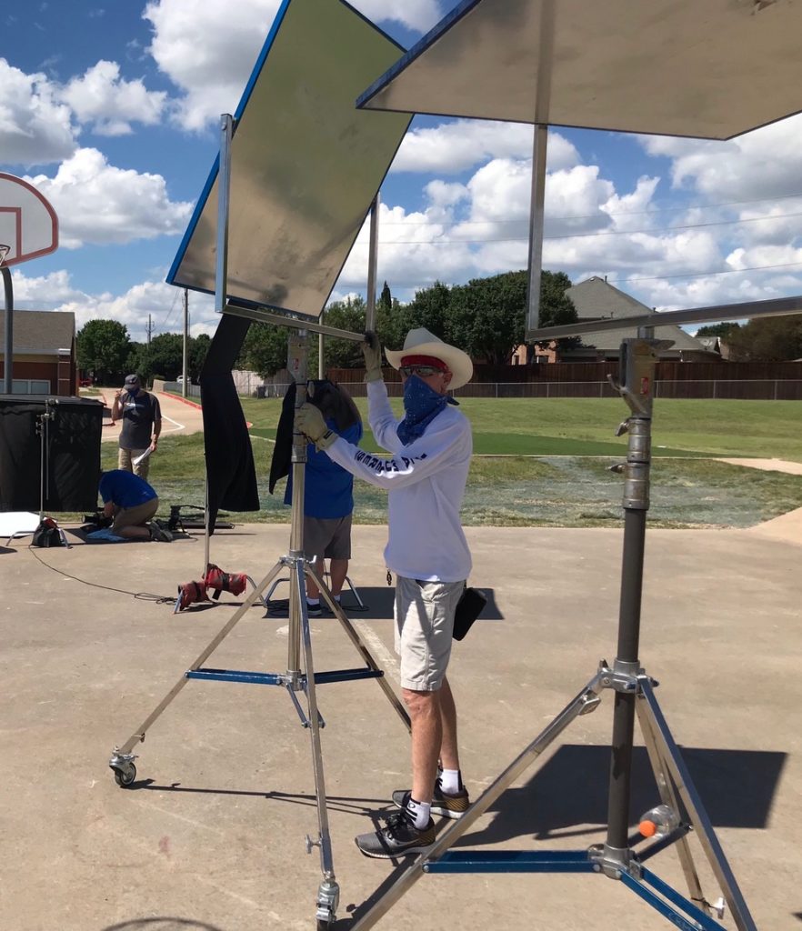 location shooting outdoors requires finding shade