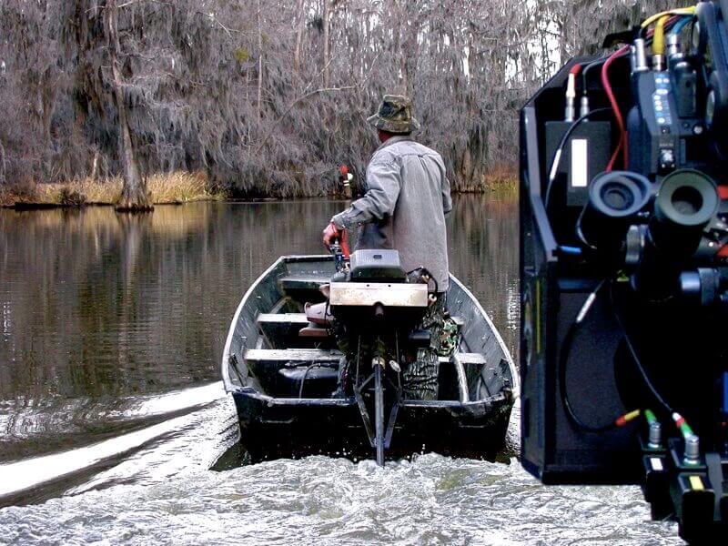 Filming on the water, swamps in a boat